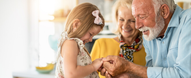 grandma and grandpa with a small child