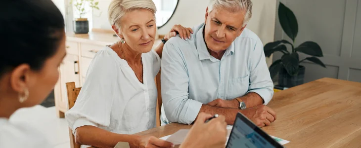 an older couple looking over documents